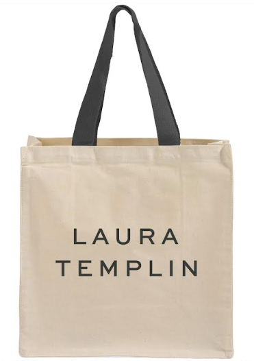 A natural canvas tote bag with black handles and the text 'LAURA TEMPLIN' printed in black on the front, shown against a plain white background.